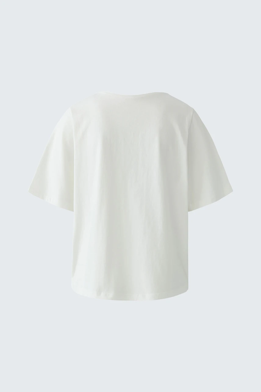 Casual women's T-shirt: Back view of a loose-fitting white tee with short sleeves.