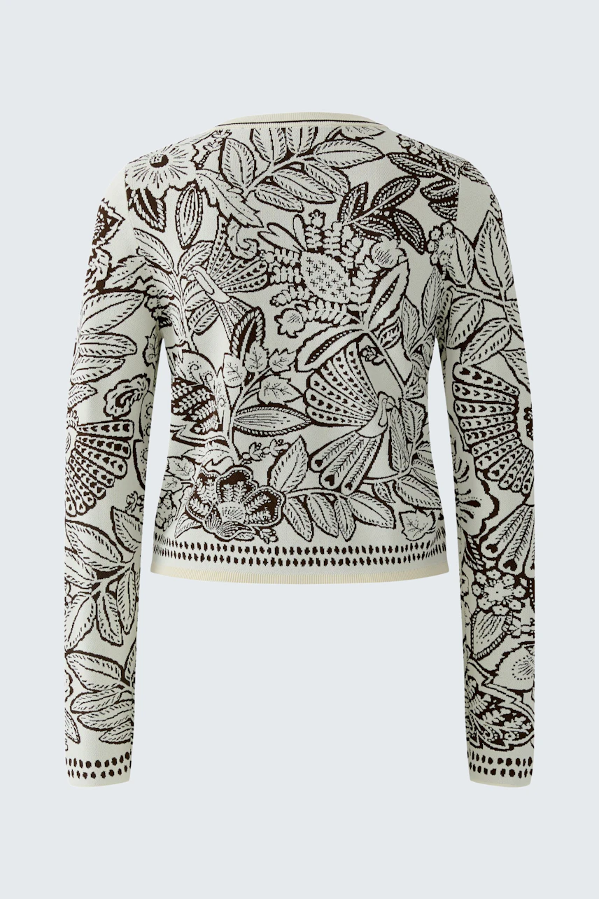 Stylish women's pullover with a floral pattern, featuring long sleeves and a cropped design.