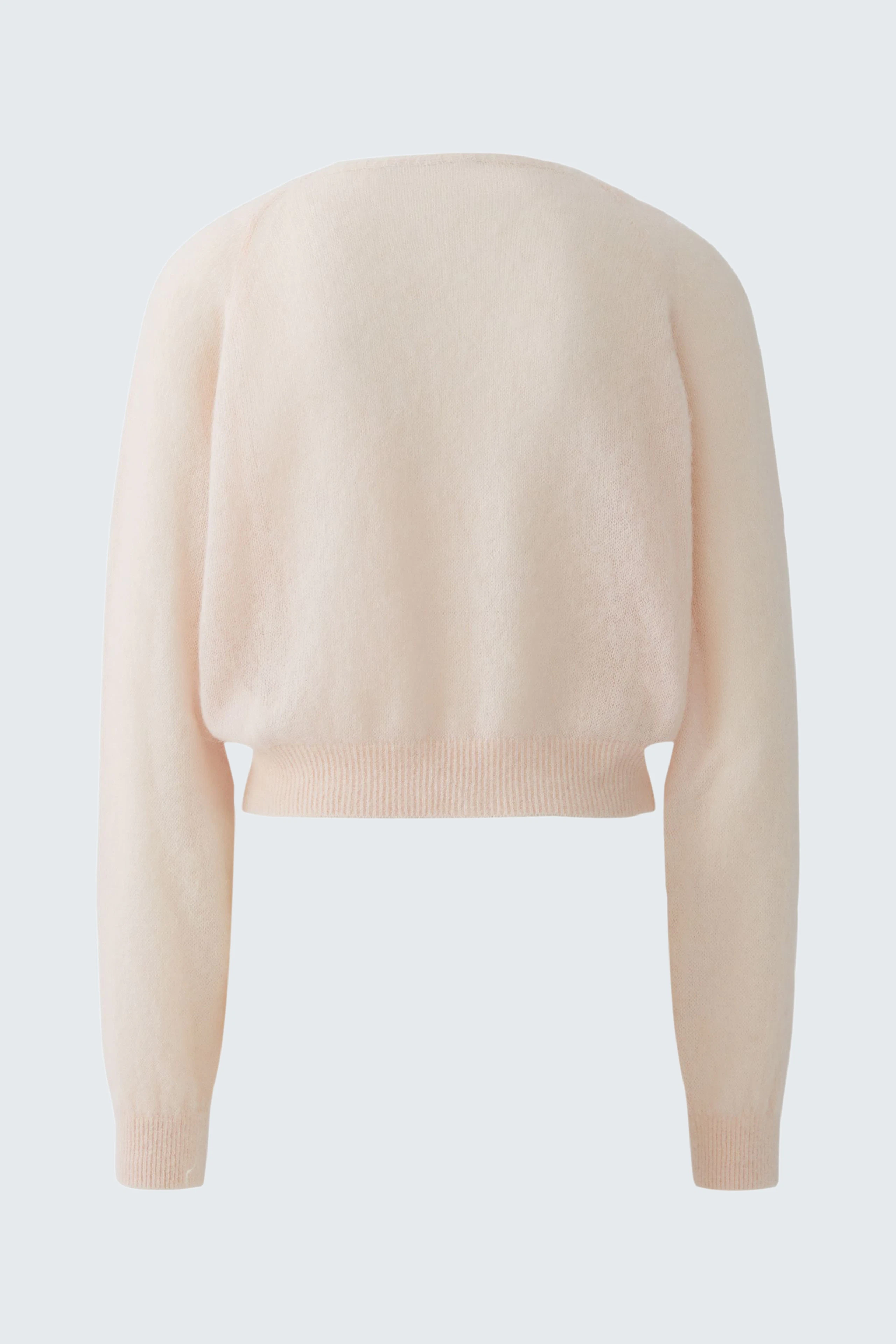 Soft knit cardigan in light pink, shown from the back. Cozy and versatile for casual wear.