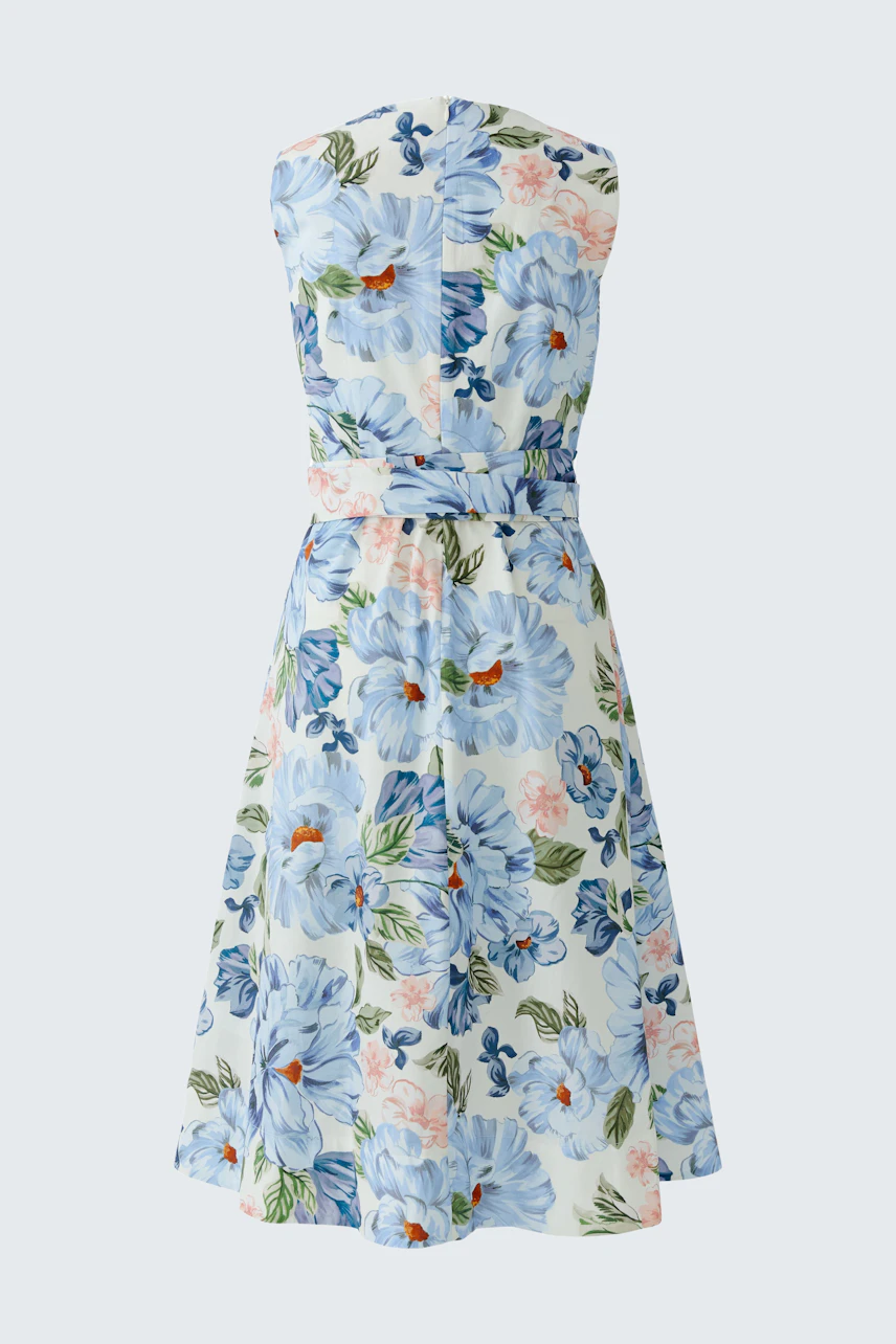 Floral midi dress: Sleeveless, blue and pink flowers on white fabric, perfect for summer days.