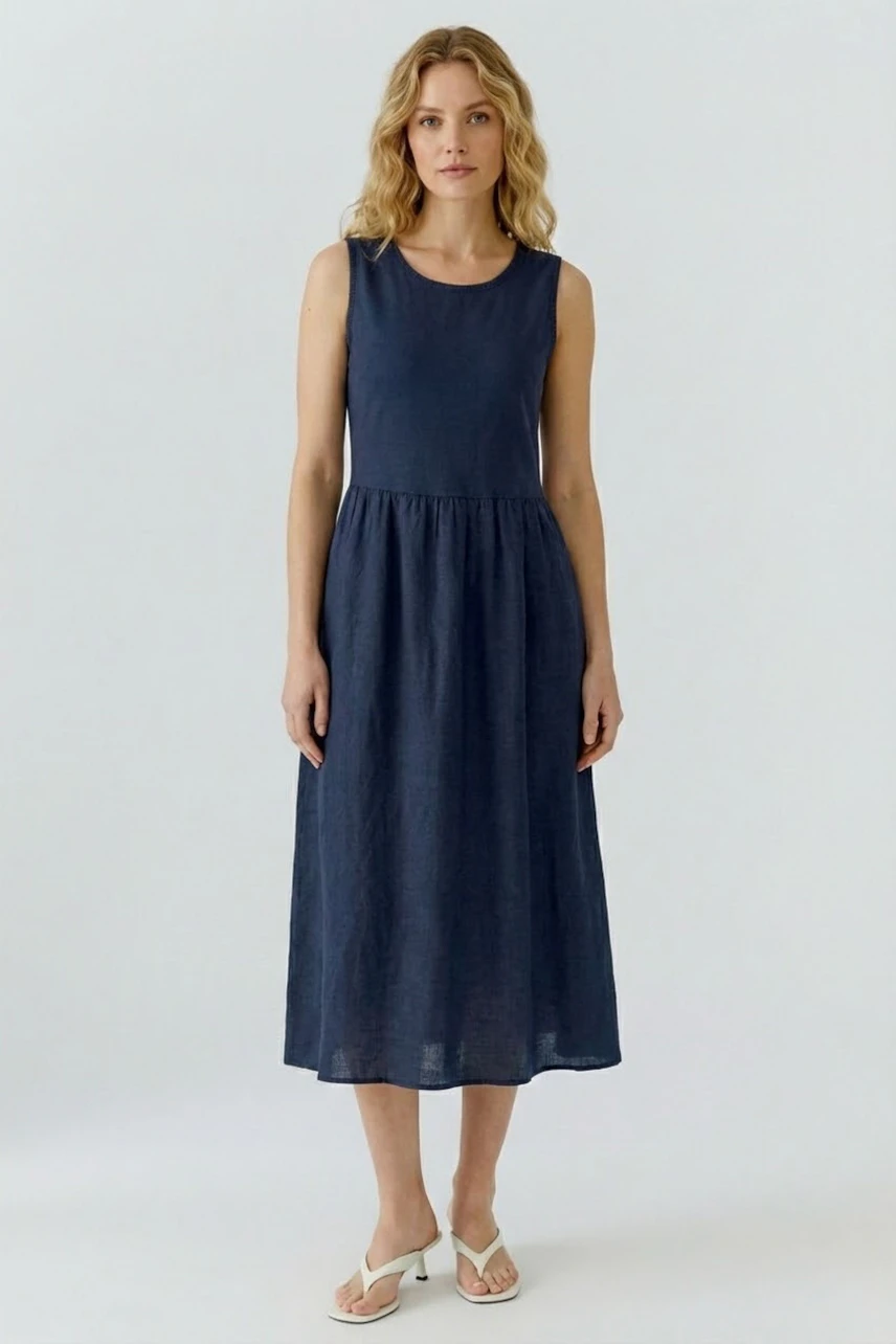 Casual women's midi dress: A woman in a navy blue sleeveless dress with a relaxed fit.