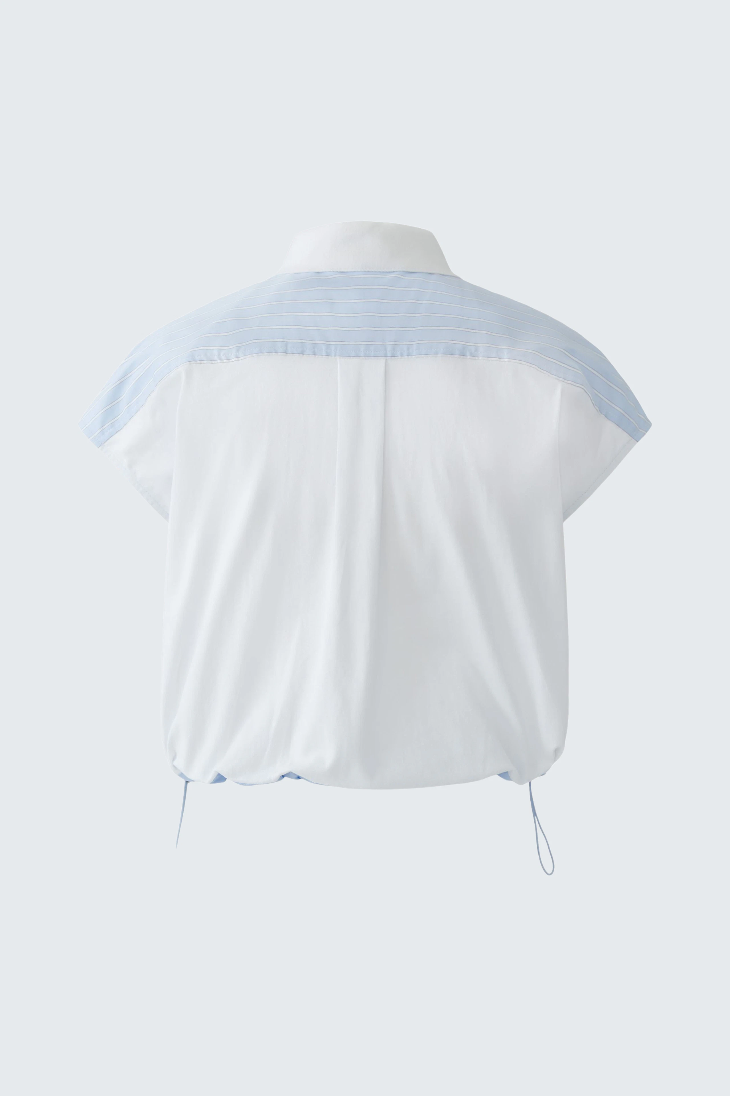 Casual women's blouse: White blouse with light blue accents, short sleeves, and a relaxed fit.