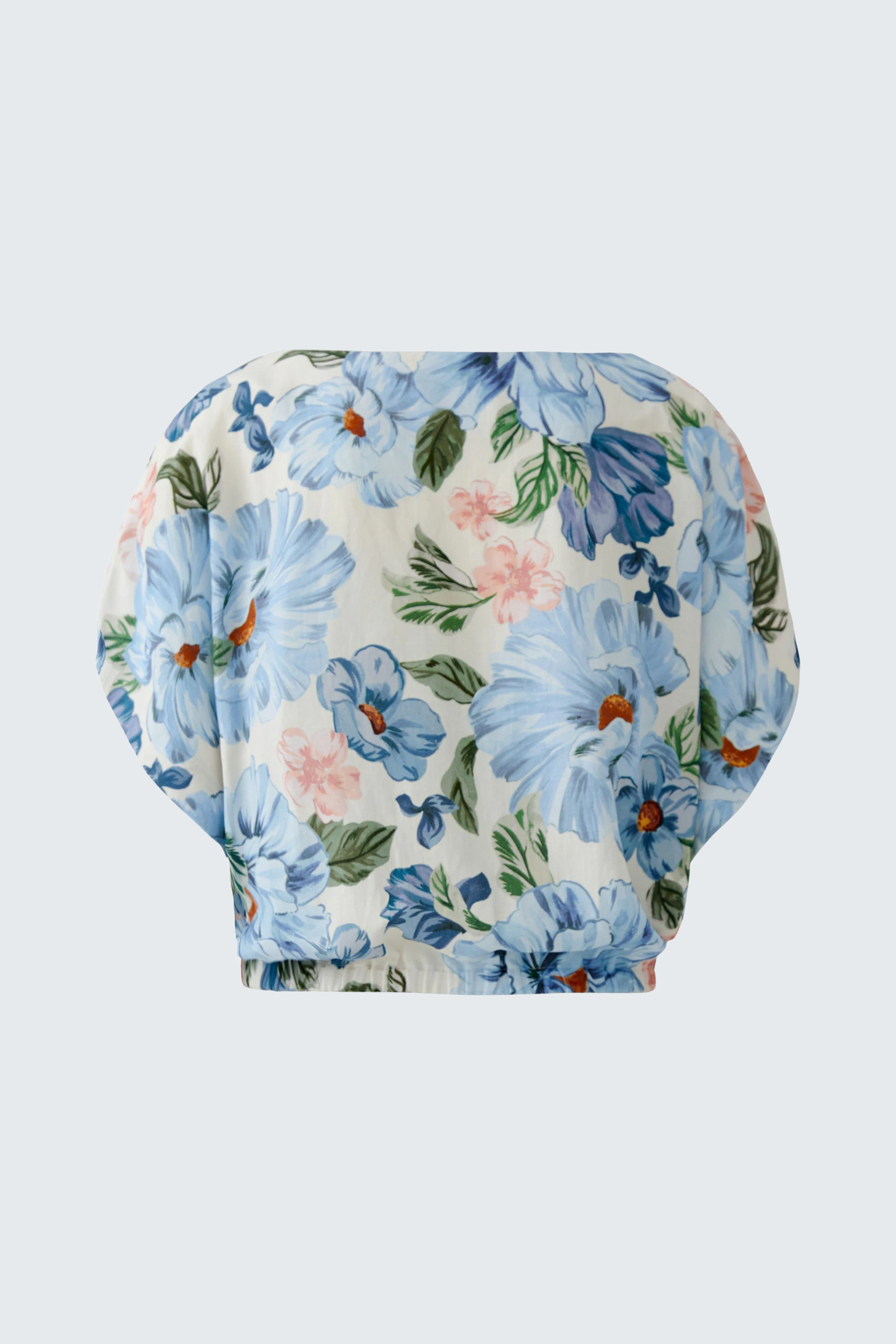Floral blouse: Light, airy fabric with blue and pink flowers, perfect for a casual, fresh look.