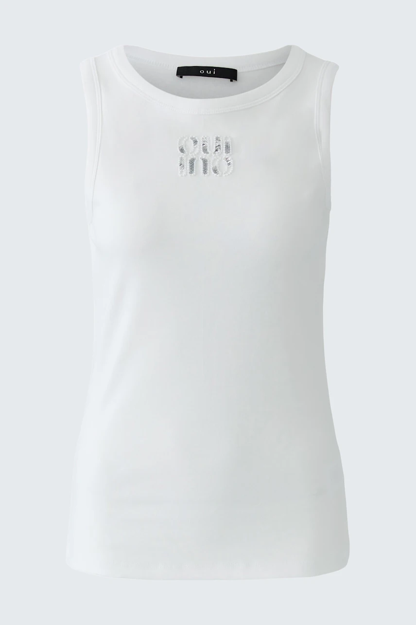 White tank top: Simple and casual design, perfect for layering or wearing alone.