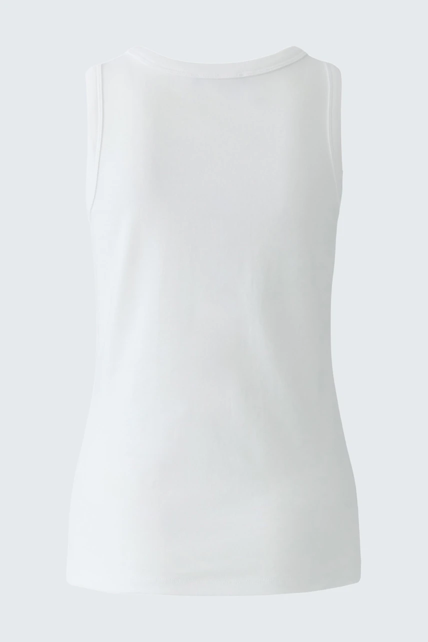 White tank top: Simple and versatile, perfect for layering or wearing alone.
