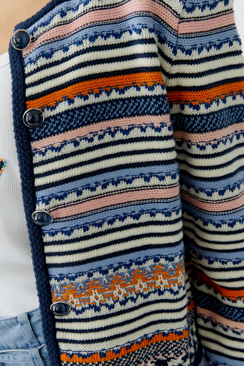 Colorful women's cardigan with stripes and buttons, perfect for casual layering.