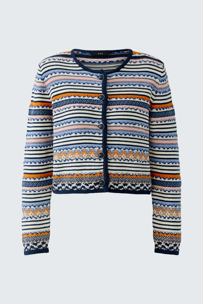 Casual women's cardigan: A woman in a colorful patterned cardigan with a cropped fit.
