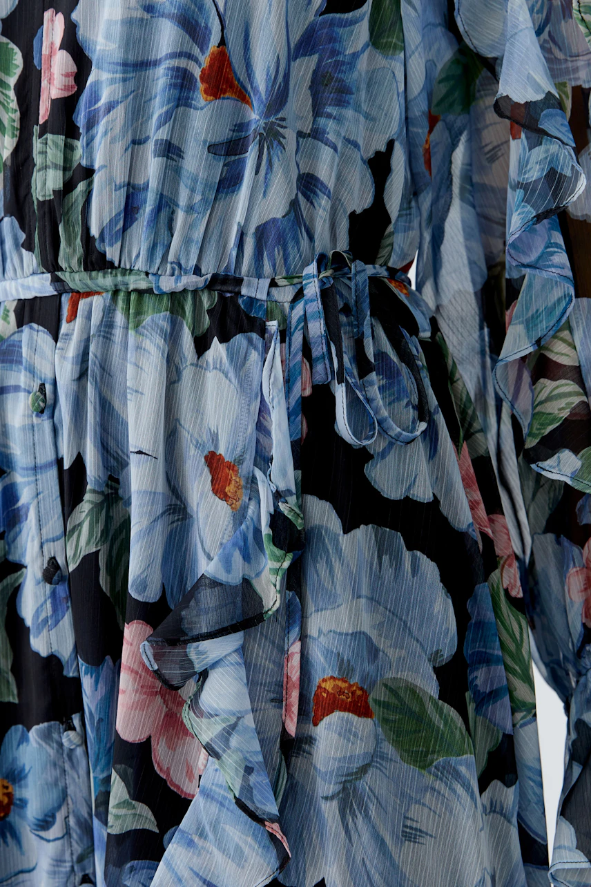 Floral maxi dress: A woman in a flowing dress with vibrant flowers, perfect for casual outings.