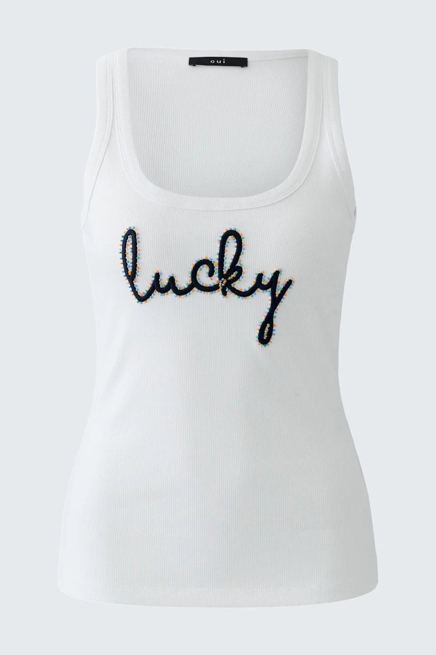 Casual women's tank top in white with 'lucky' embroidery.