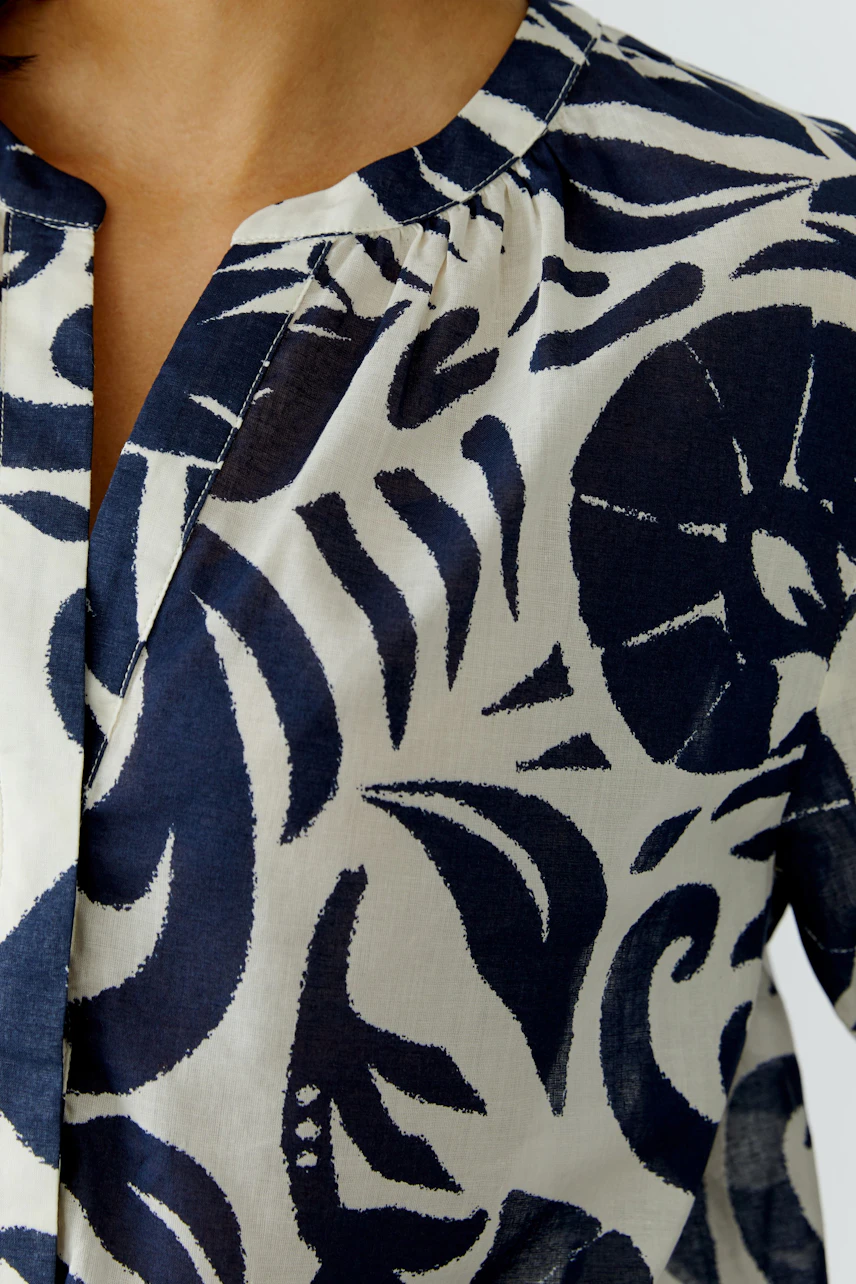 Stylish women's tunic with a unique navy and cream pattern, perfect for casual wear.