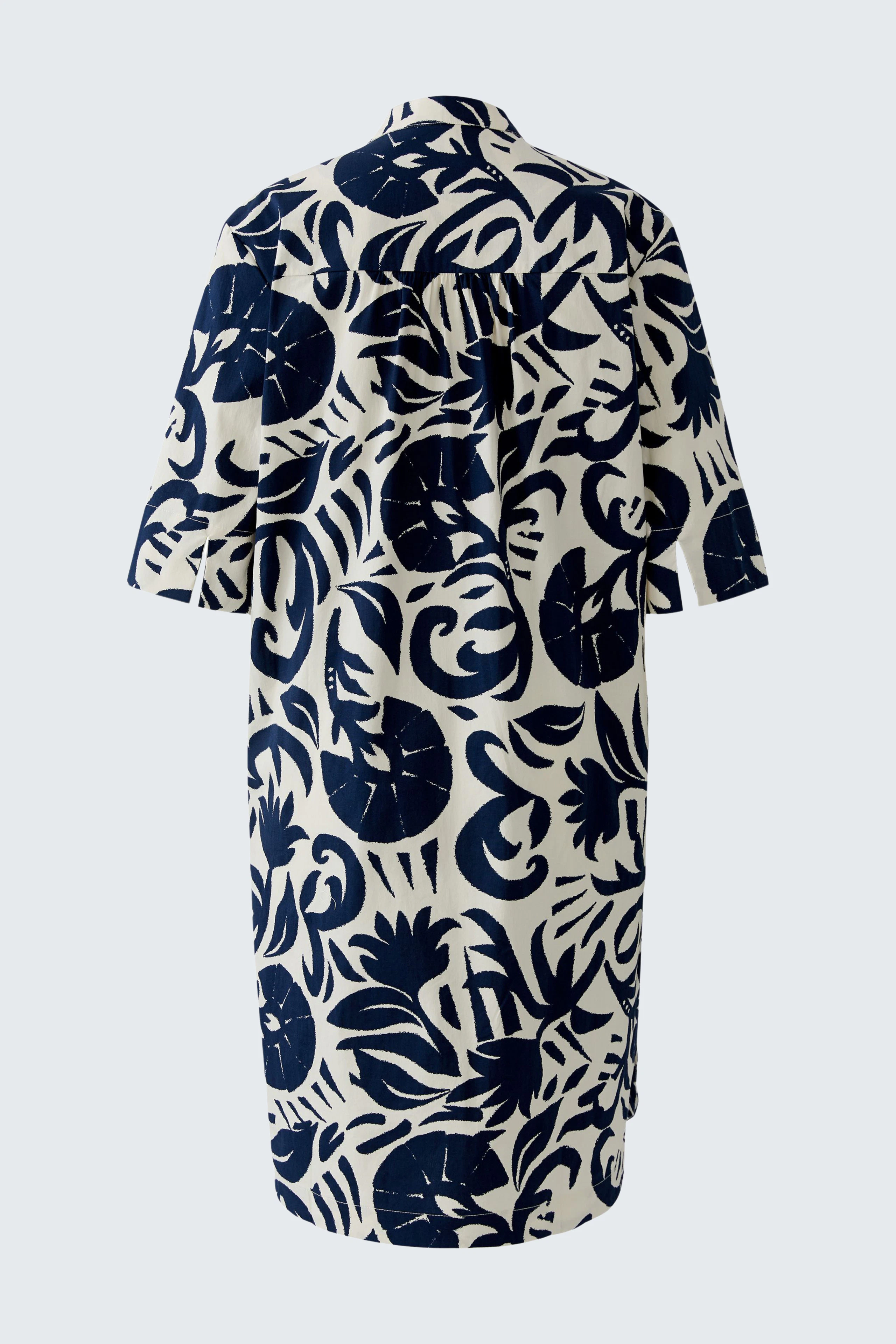 Flowy hanger dress with bold navy floral print, perfect for a casual and stylish look.