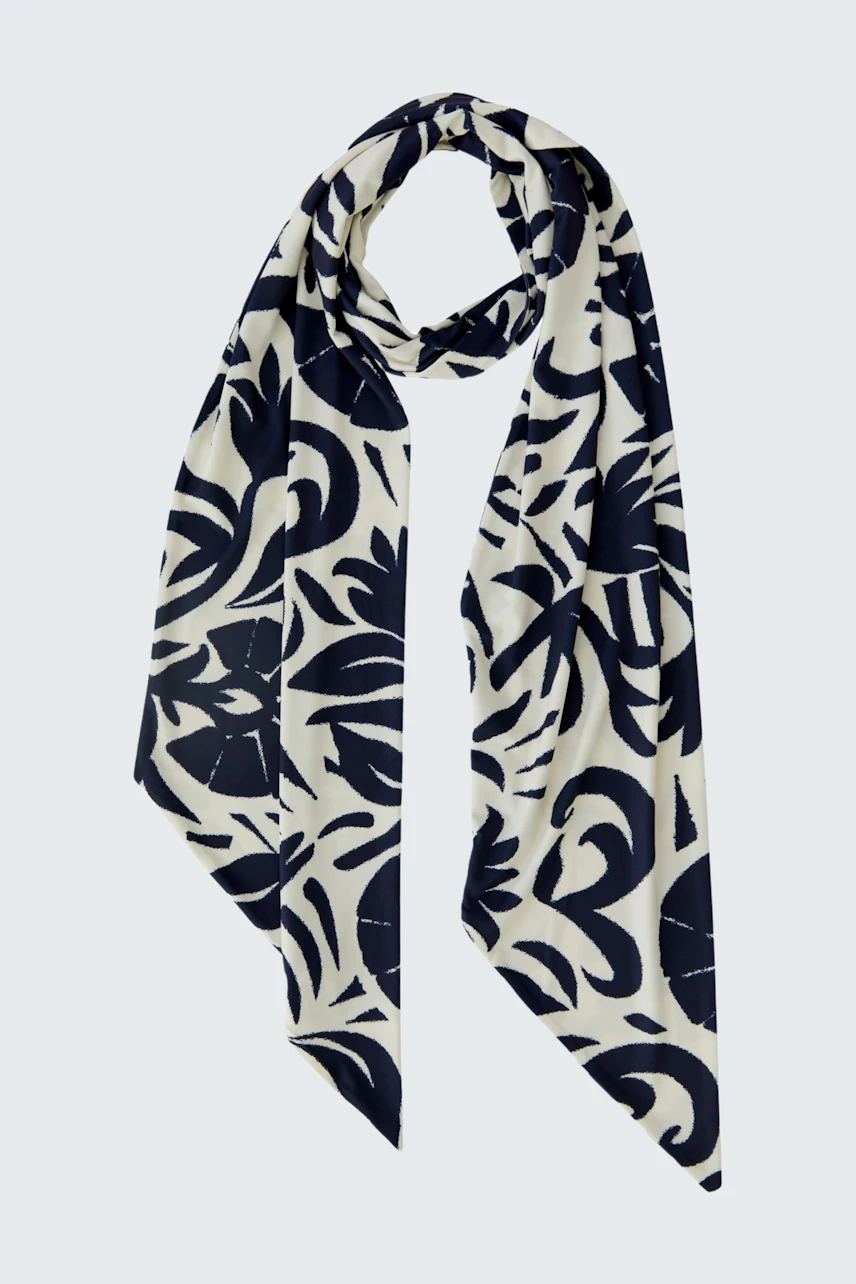 Stylish scarf: A patterned scarf in navy and cream, perfect for adding flair to any outfit.