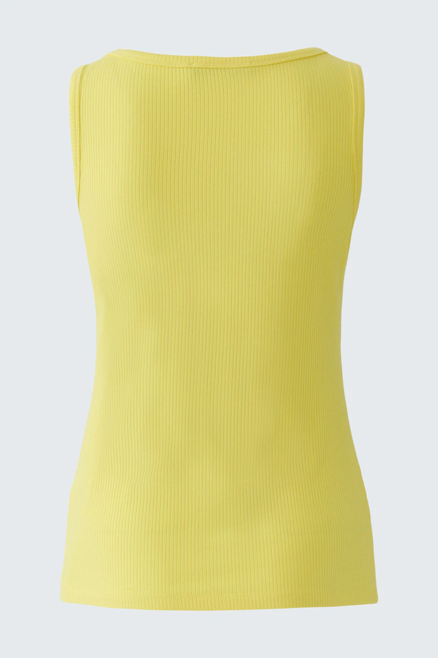 Yellow sleeveless top: Simple and casual design, perfect for layering or wearing alone.