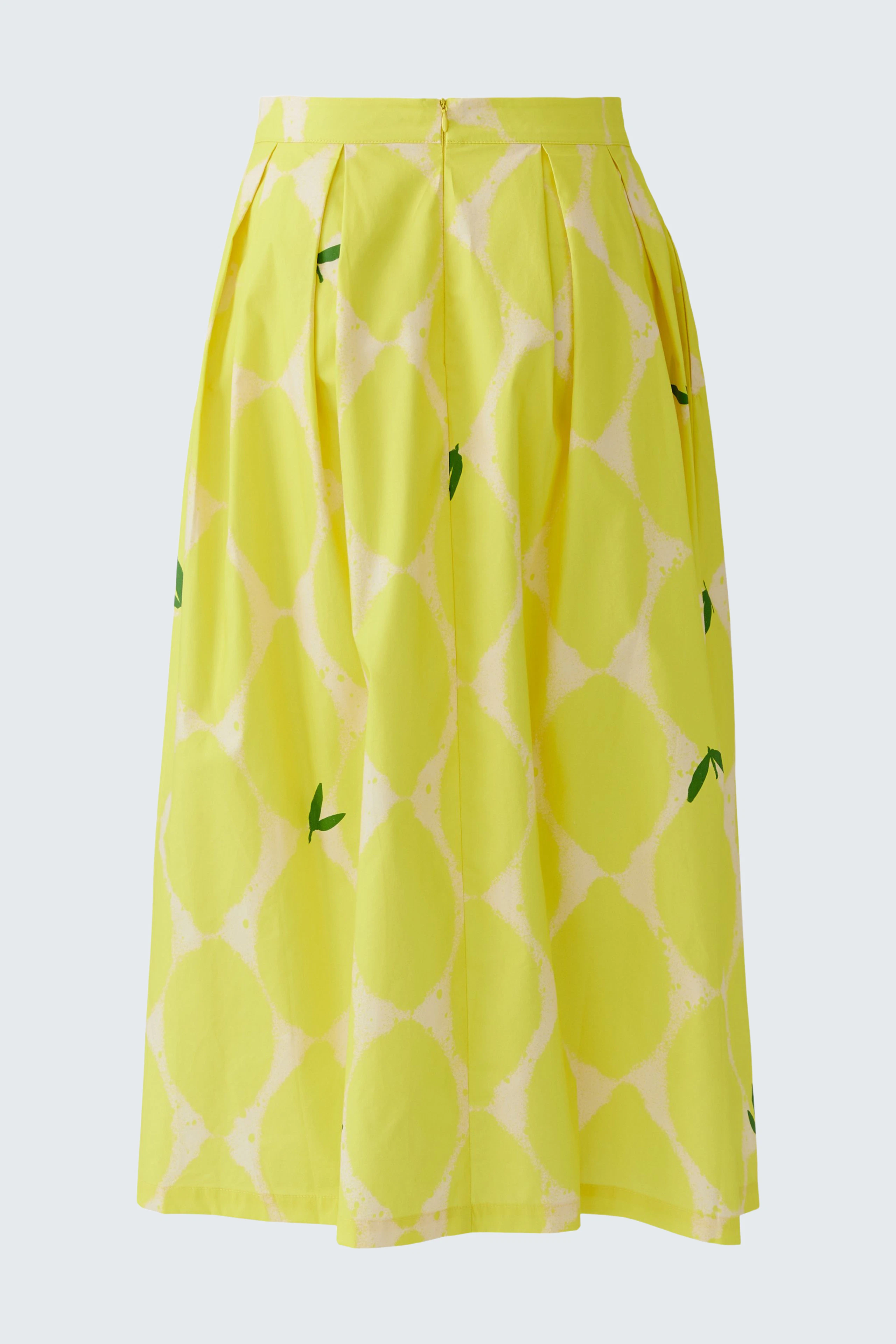 Bright yellow pleated skirt with a playful pattern, perfect for a vibrant summer look.