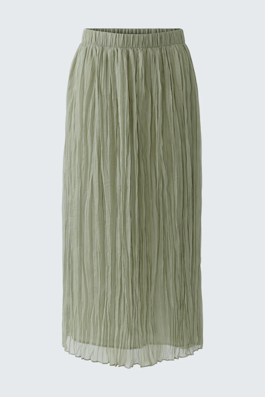 Green pleated skirt: A stylish, textured piece perfect for versatile, everyday wear.