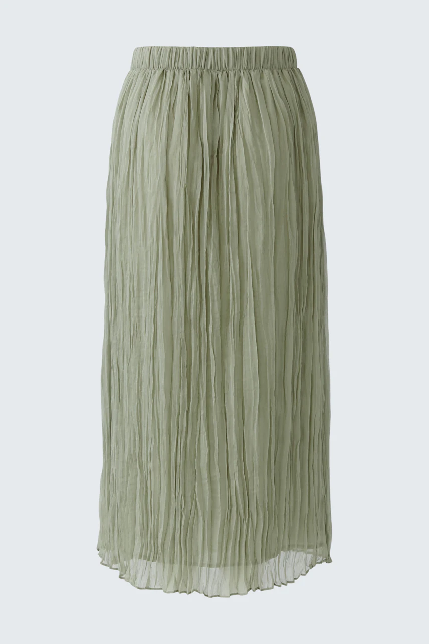 Green pleated skirt: Lightweight, textured fabric with a comfortable elastic waistband.