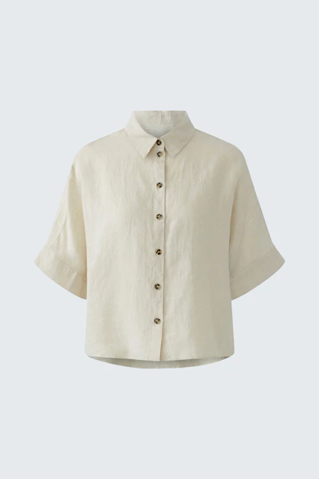 Casual women's blouse: Cream-colored blouse with short sleeves and button-up front, perfect for everyday wear.