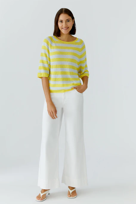 Casual pullover: Yellow and white striped pullover with three-quarter sleeves, perfect for a relaxed look.