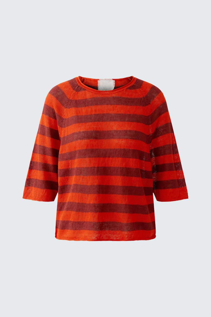 Casual women's pullover: Bright red and orange striped pullover with three-quarter sleeves.