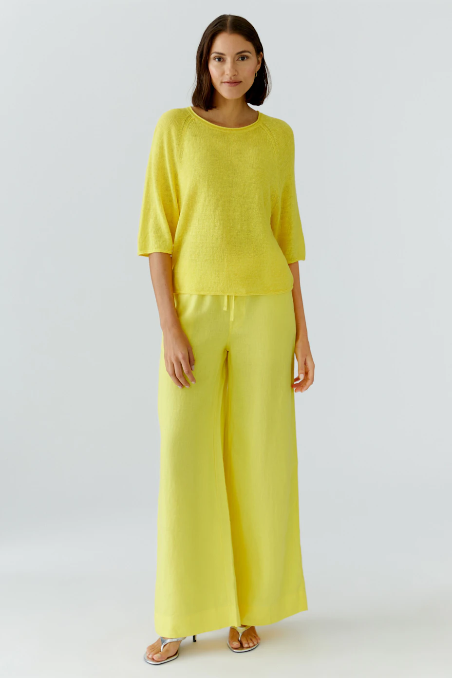 Bright yellow pullover with 3/4 sleeves, perfect for a casual and vibrant look.