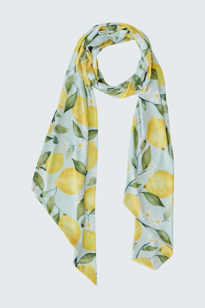 Vibrant lemon-patterned scarf on white background, perfect for adding a fresh touch to any outfit.