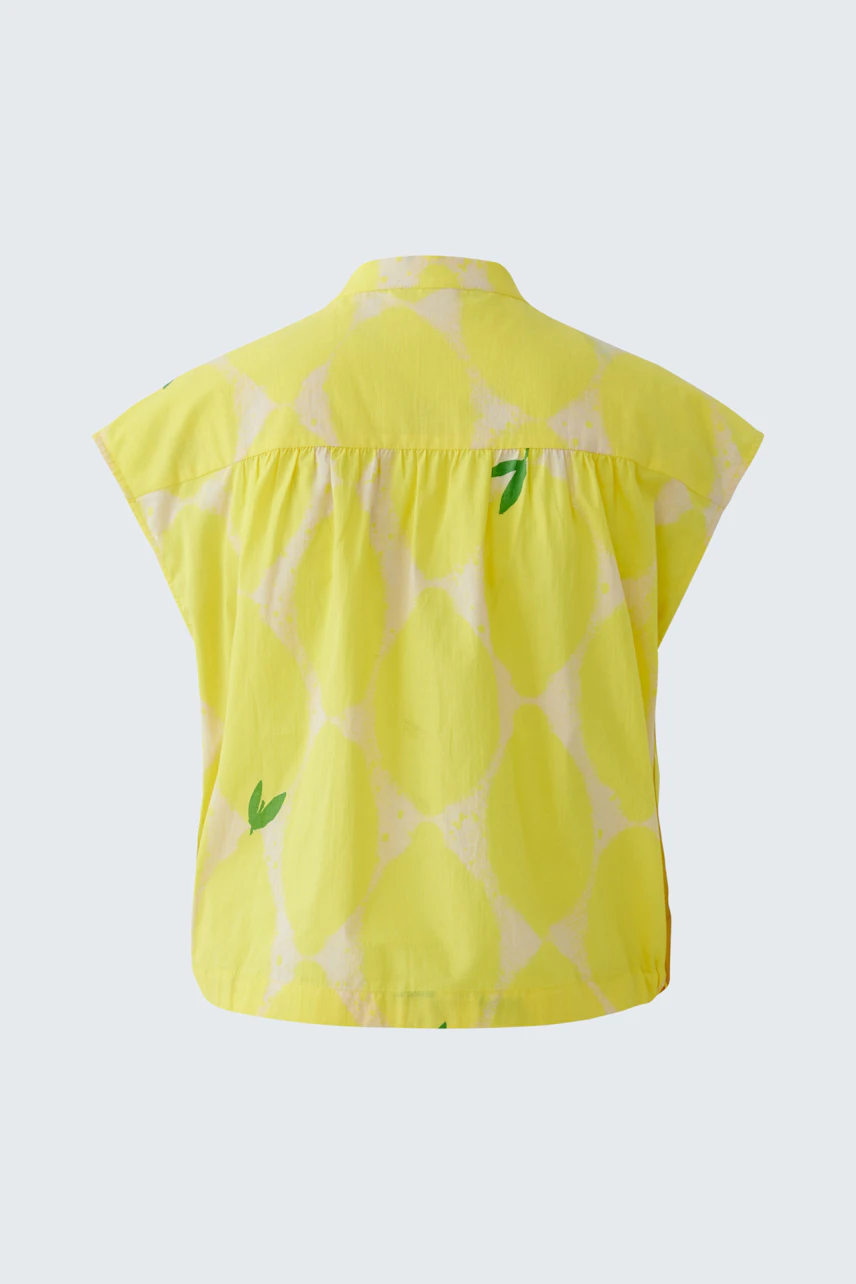 Gelbe Damen-Bluse mit grafischem Muster, Rückansicht. Ideal für sommerliche Outfits.