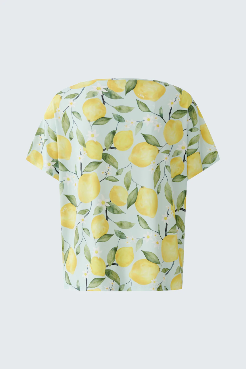 Frisches Damen-T-Shirt: Zitronenprint auf hellem Stoff, ideal für sommerliche Tage.