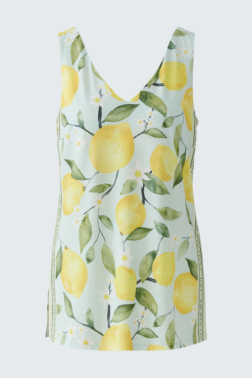 Sommerliches Damen-Top: Weißes Top mit frischem Zitronenprint, ideal für warme Tage.