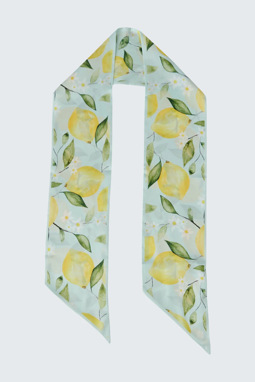 Colorful scarf with lemon print, perfect for adding a fresh touch to any outfit.