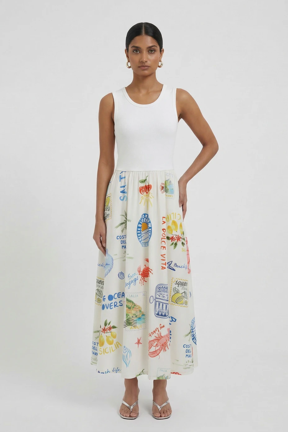 Colorful midi dress: Sleeveless white top with a vibrant, printed skirt featuring various motifs.