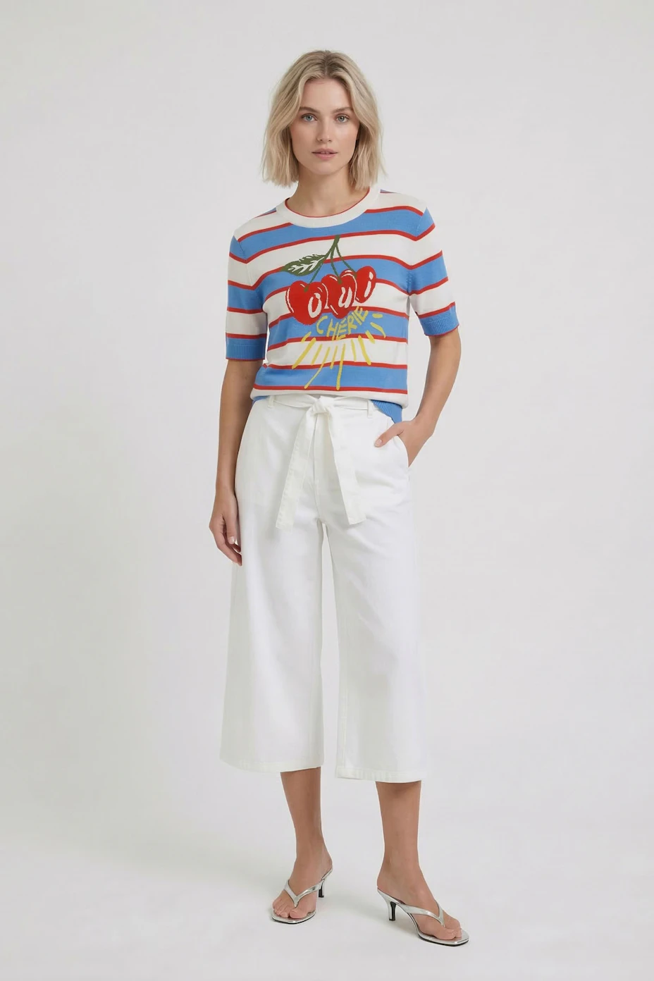 Colorful women's pullover with cherry print and stripes, perfect for a casual look.