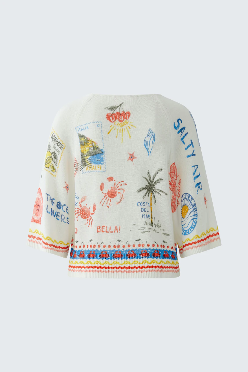 Colorful women's pullover with beach-themed prints and wide sleeves, perfect for a casual look.