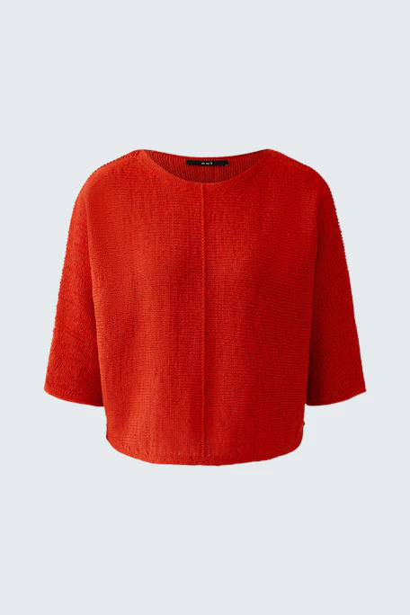 Bright red pullover with wide sleeves, perfect for a bold and casual look.