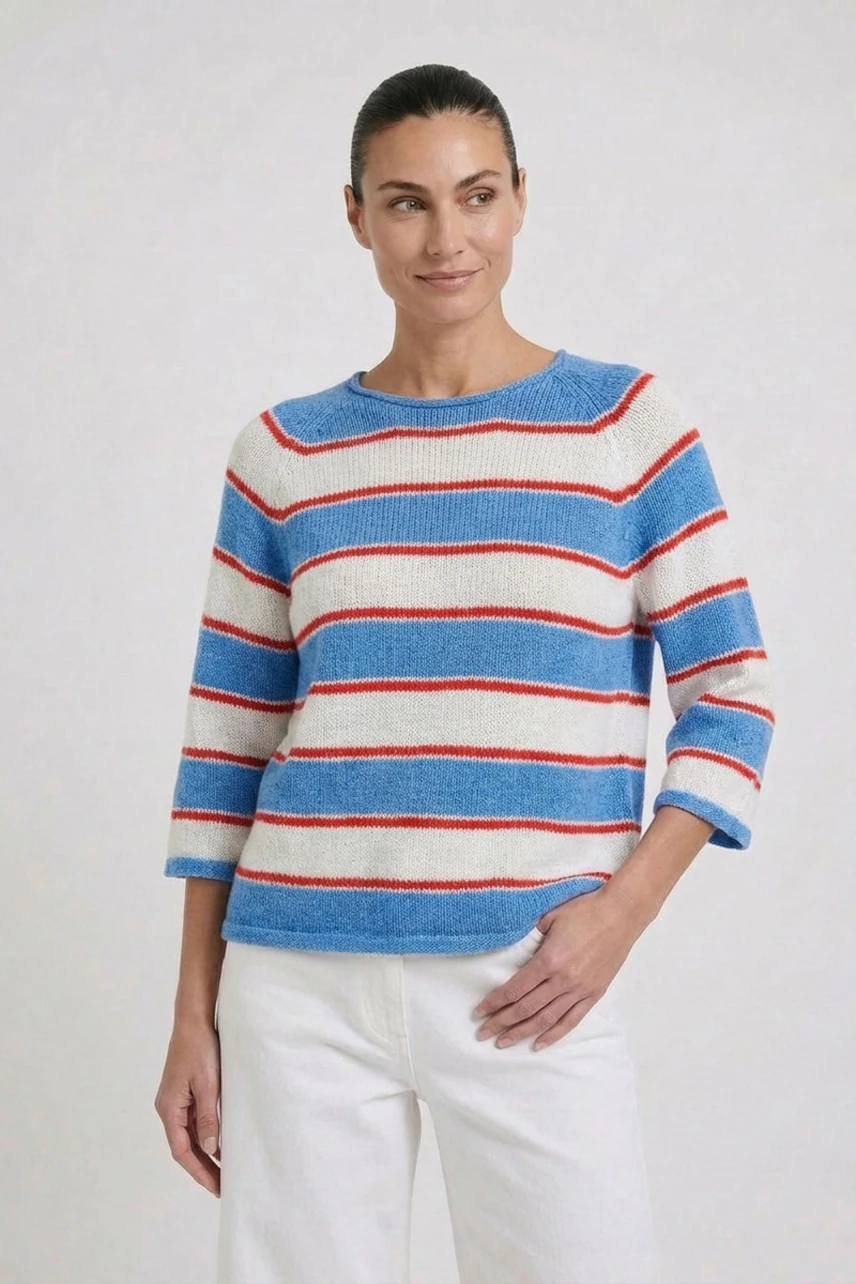 Casual women's pullover: Woman in a striped blue, red, and white pullover with 3/4 sleeves, smiling.