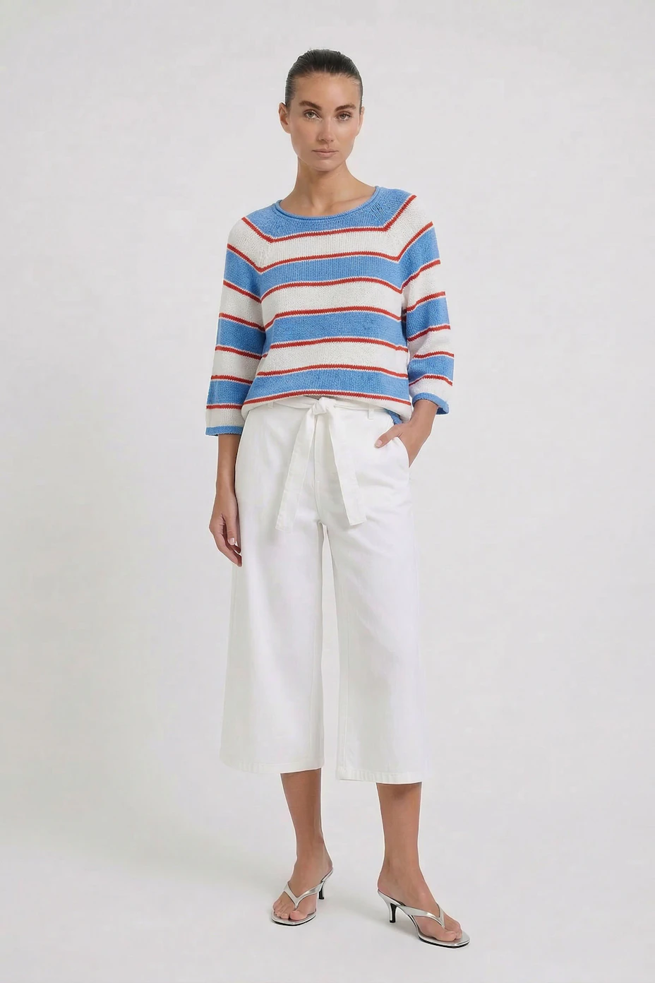 Striped pullover: Blue, white, and red striped pullover with a relaxed fit, no model visible.