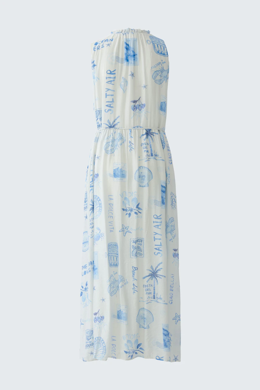 Casual maxi dress: Sleeveless white dress with blue prints, perfect for a relaxed summer day.
