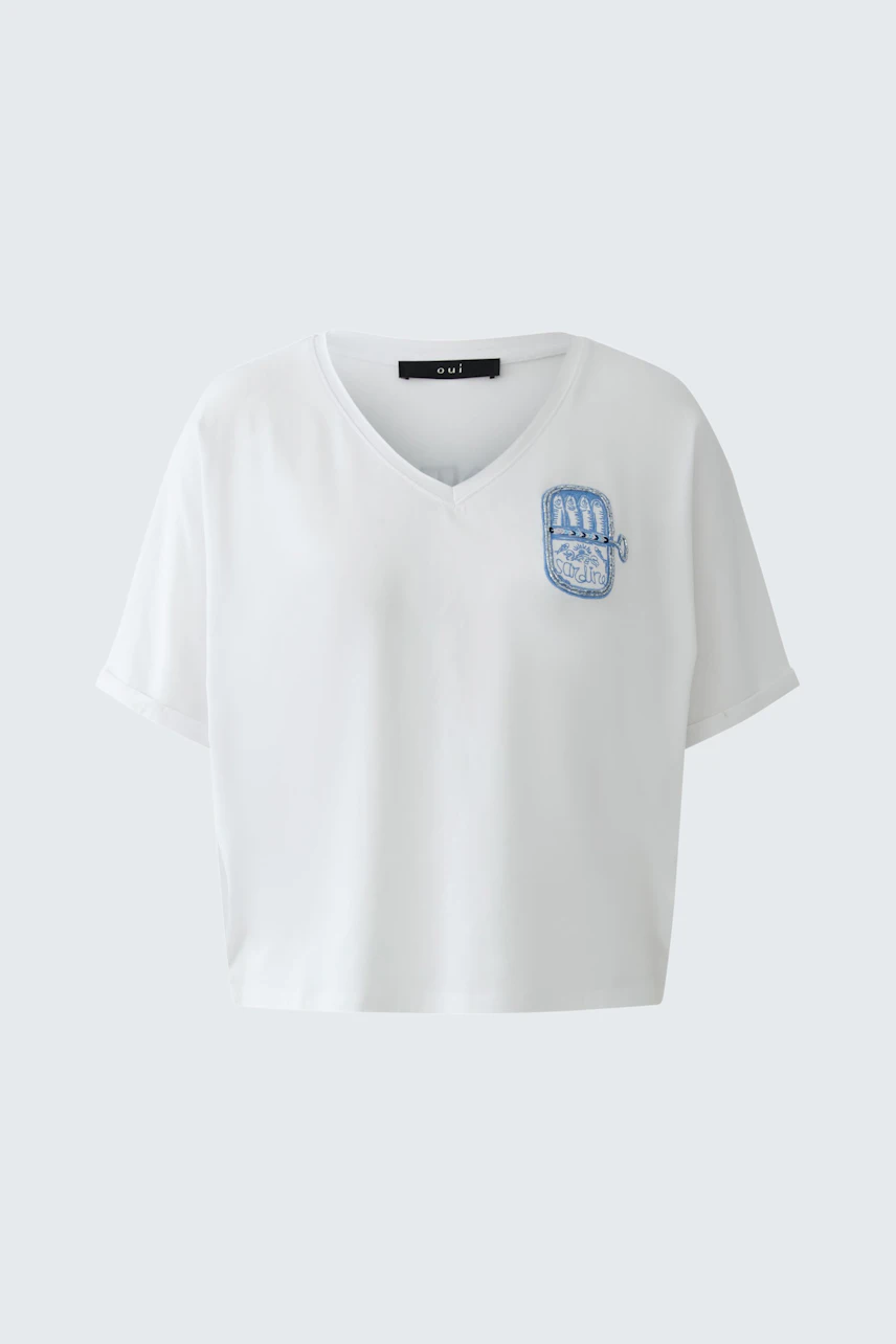 Casual women's T-shirt: White V-neck with blue graphic on chest, short sleeves, relaxed fit.