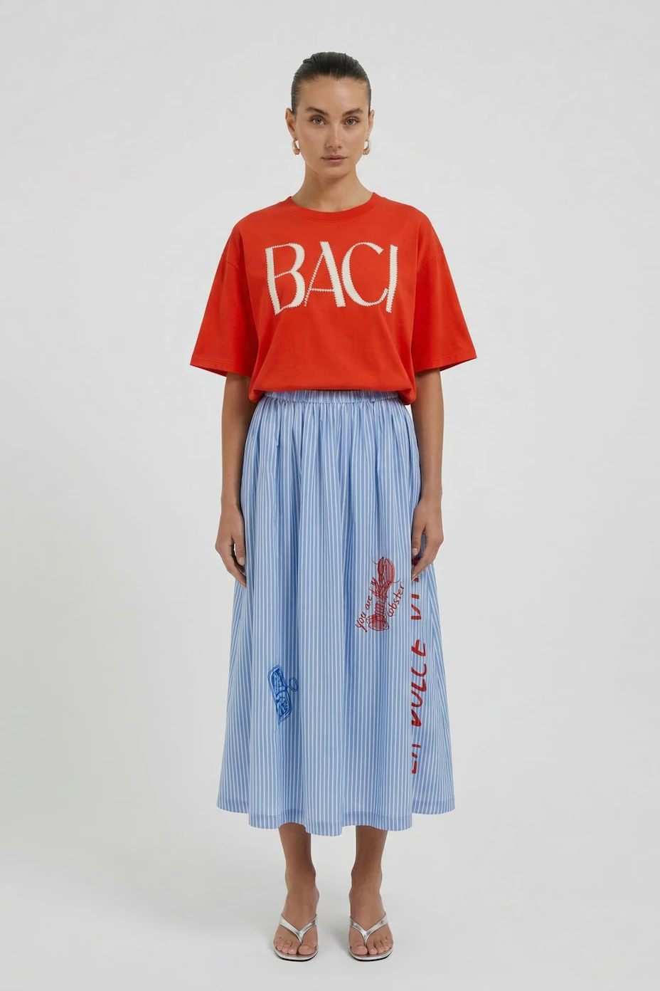 Casual women's T-shirt: Bright red with 'BACI' text, featuring a drawstring hem for a relaxed fit.