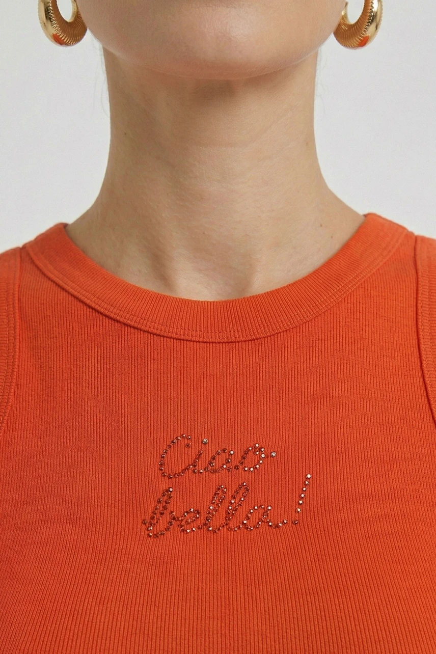 Orange tank top with 'Ciao bella!' text, worn by a woman with gold hoop earrings.