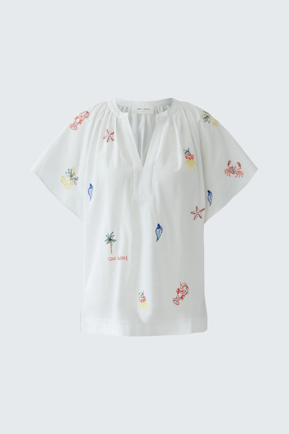 White blouse with colorful embroidery, short sleeves, and a relaxed fit. No model, just the blouse.