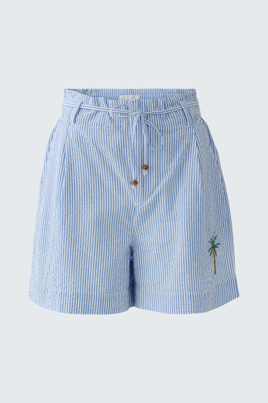 Casual women's shorts: Light blue striped shorts with palm tree embroidery, perfect for summer days.