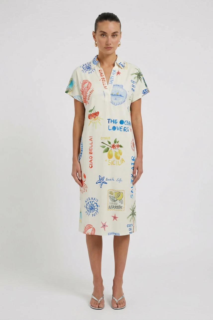 Casual A-line dress: Woman in a printed A-line dress with colorful graphics, standing confidently.