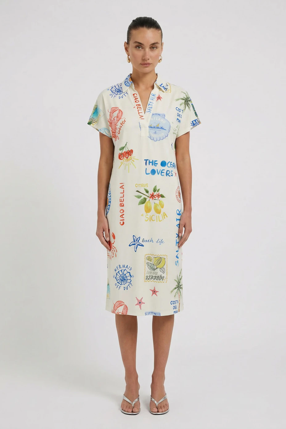 A-line dress with colorful prints, short sleeves, and a relaxed fit. Perfect for casual summer days.