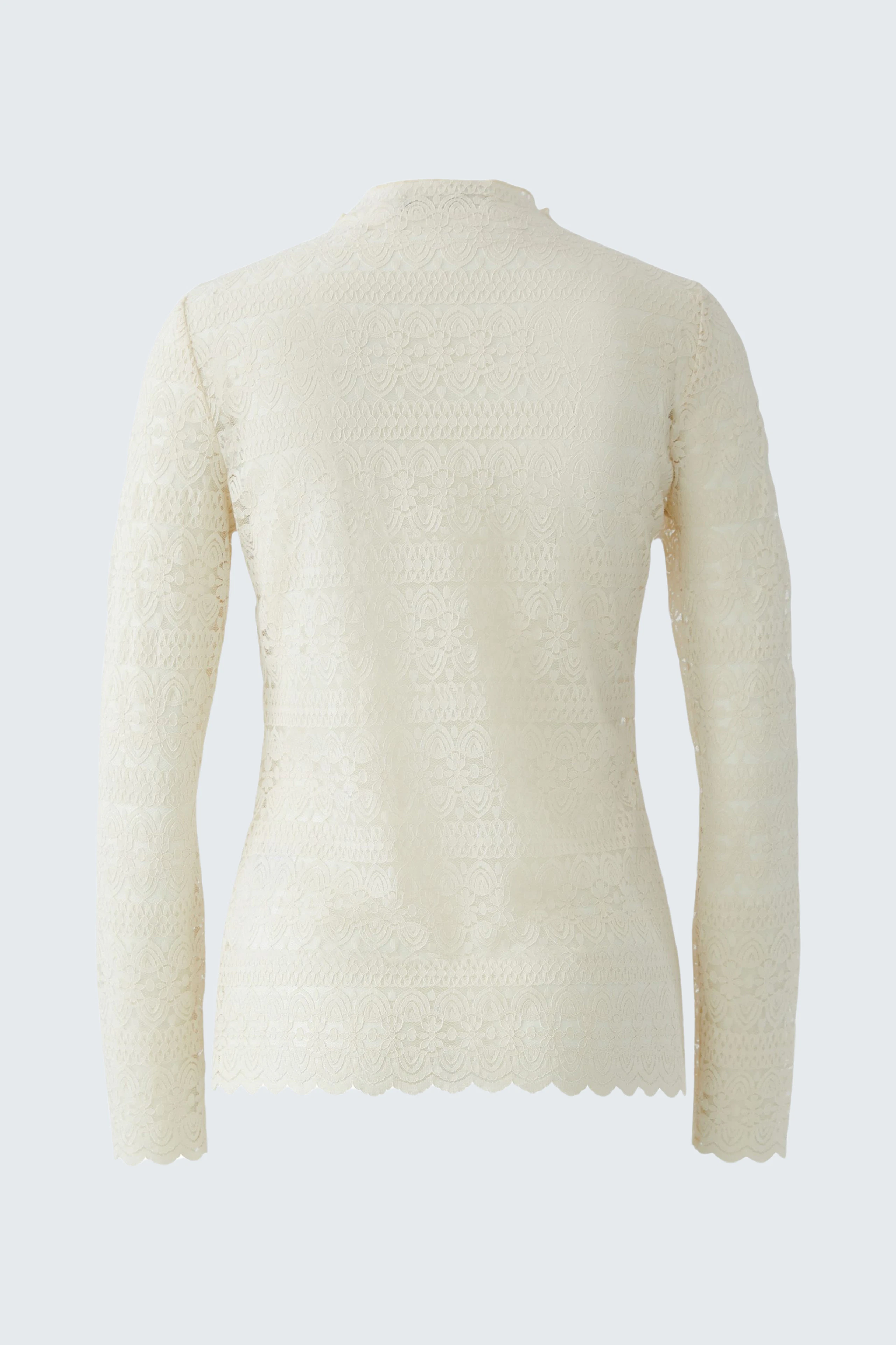Casual long-sleeve shirt: A woman in a cream-colored pullover with a textured finish, viewed from the back.