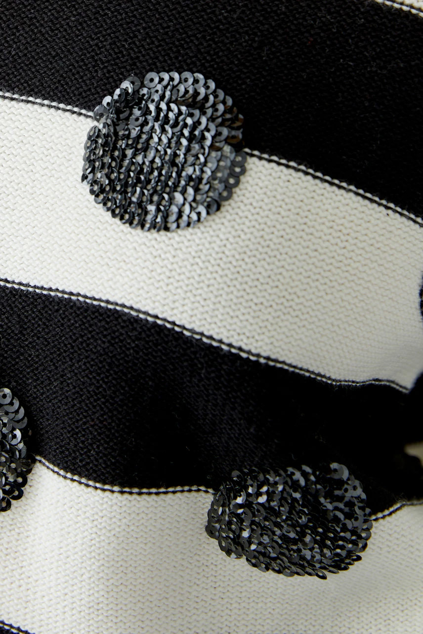 Striped pullover with black sequins, no model visible. Casual and stylish for everyday wear.