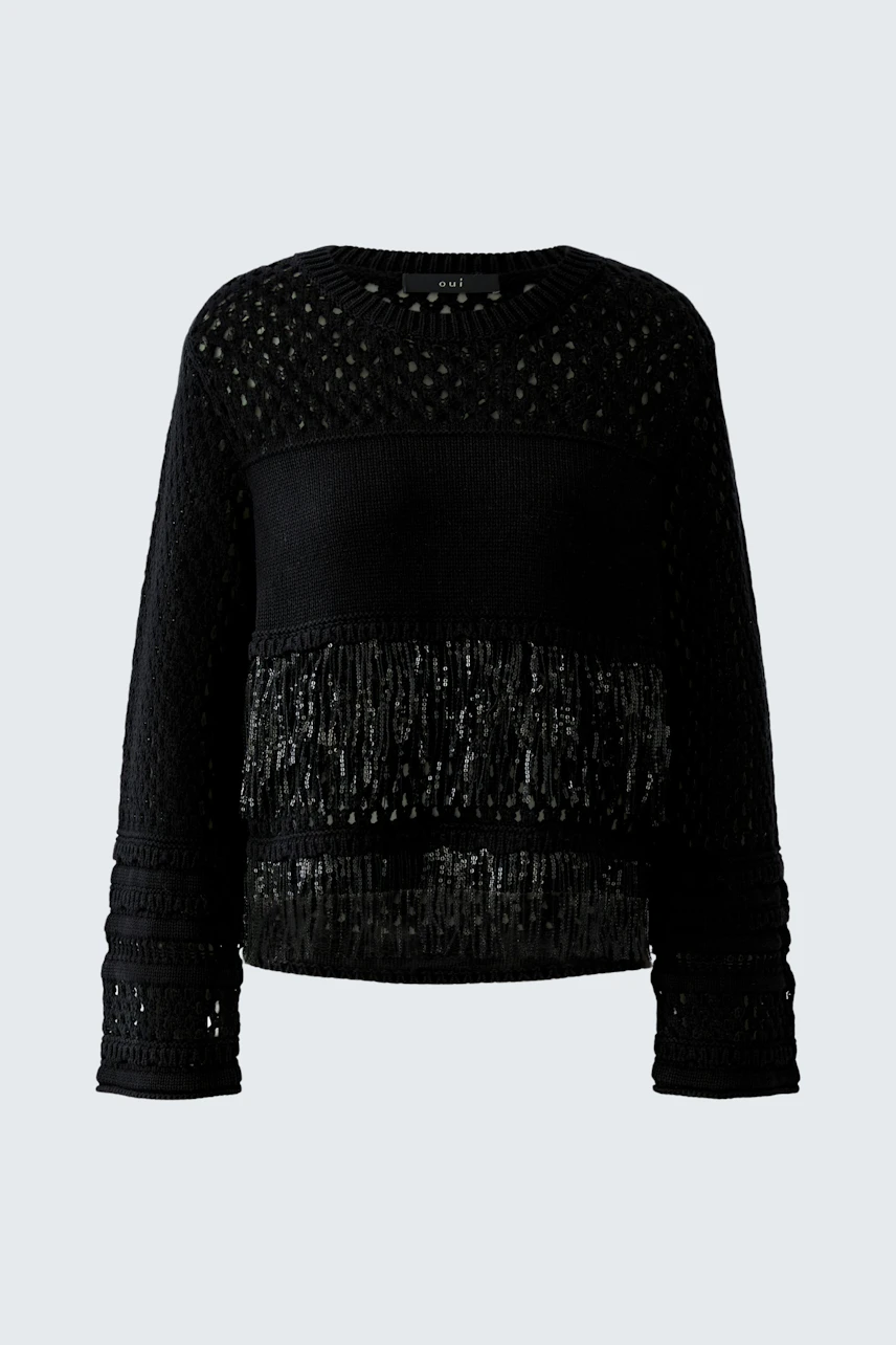 Black pullover with textured knit and fringe details, perfect for a stylish, casual look.