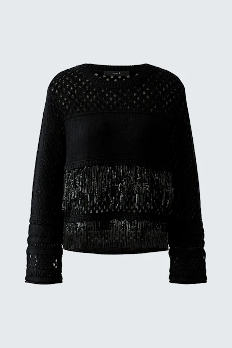 Schwarzer Damen-Pullover: Strickdesign mit transparenten Details und Fransen für einen modernen Look.