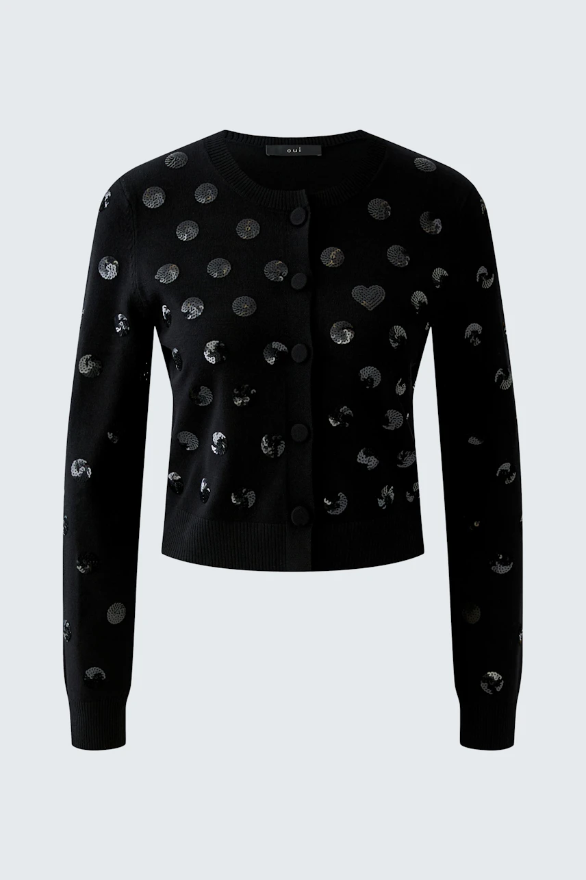 Black cardigan with polka dots, no model. Simple, stylish design for versatile wear.