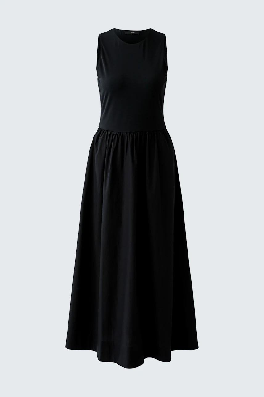 Black sleeveless midi dress with a flowing skirt, perfect for versatile styling.