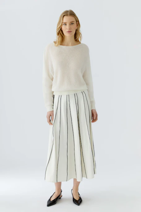 A-line skirt: White with black vertical stripes, flowing design, perfect for casual wear.